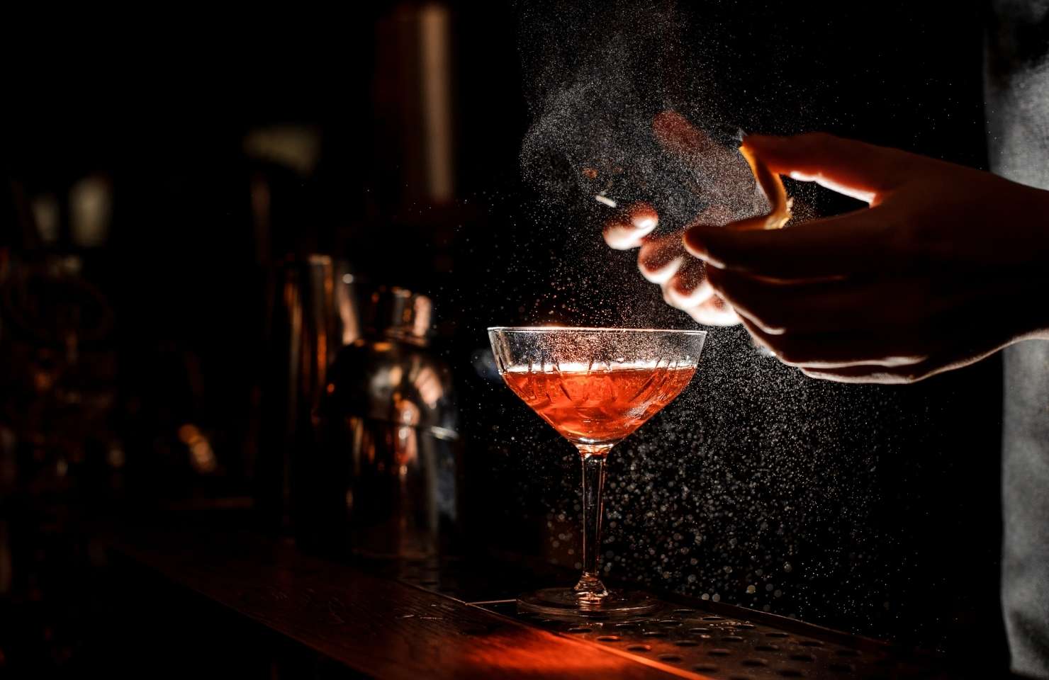 a cocktail on a bar at night
