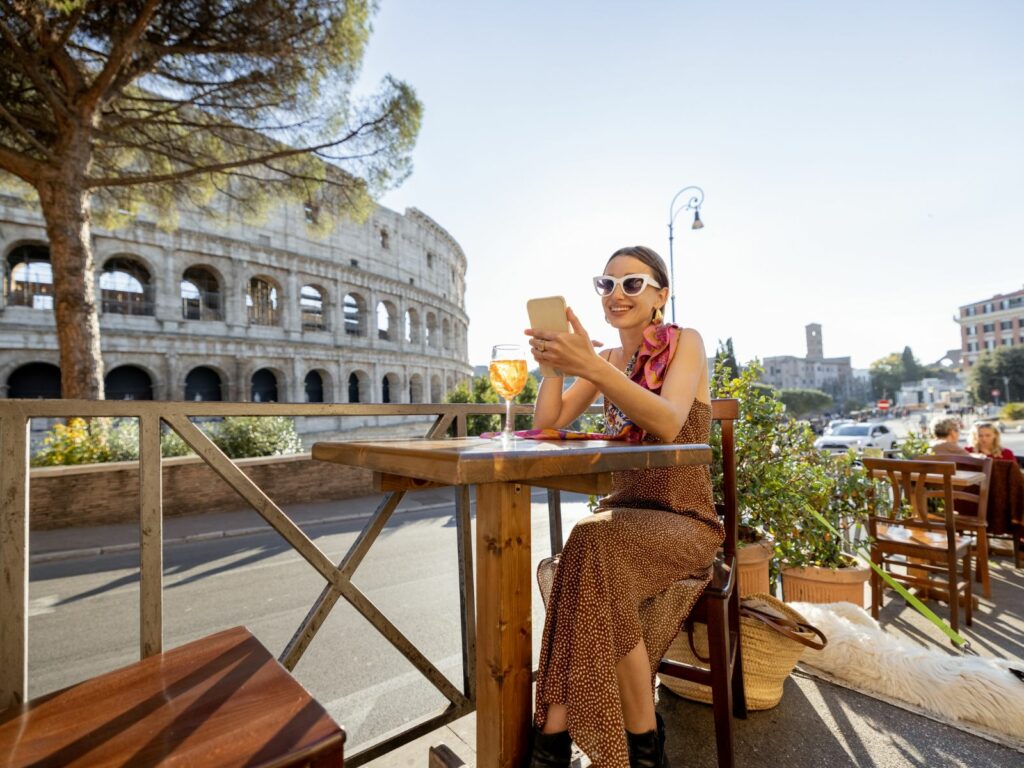 a lady spends her weekend in rome with an Aperol spritz in the sun
