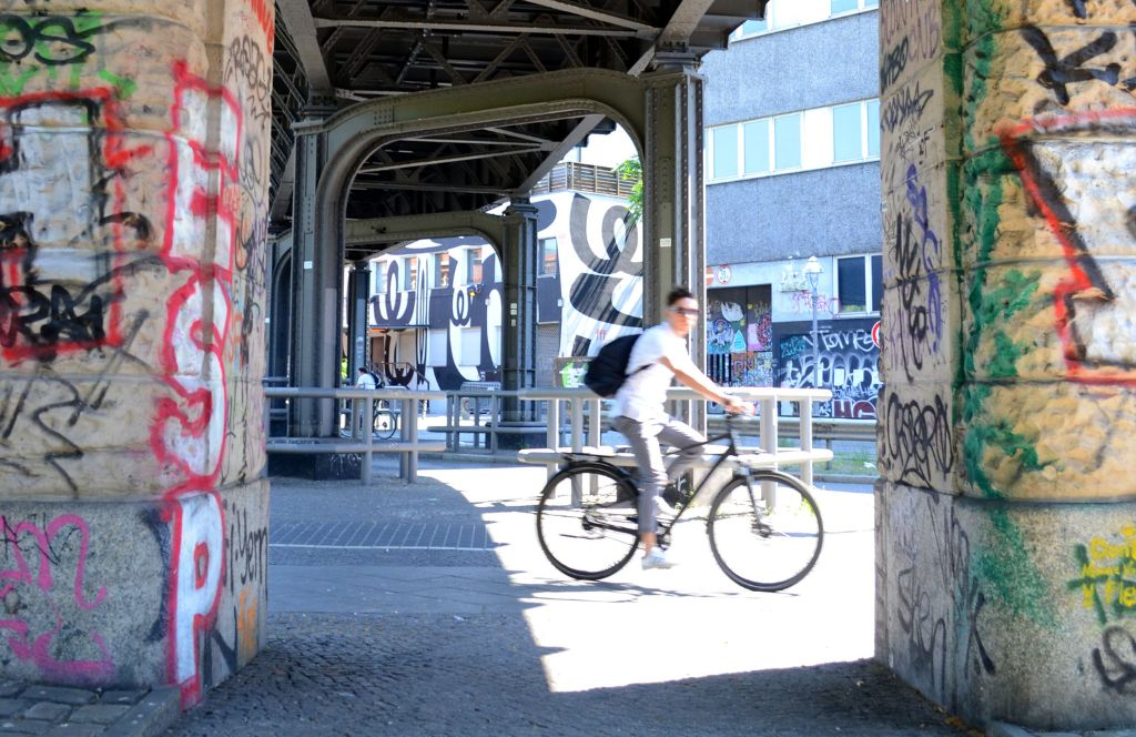 a cyclist in kreuzberg during a weekend in berlin