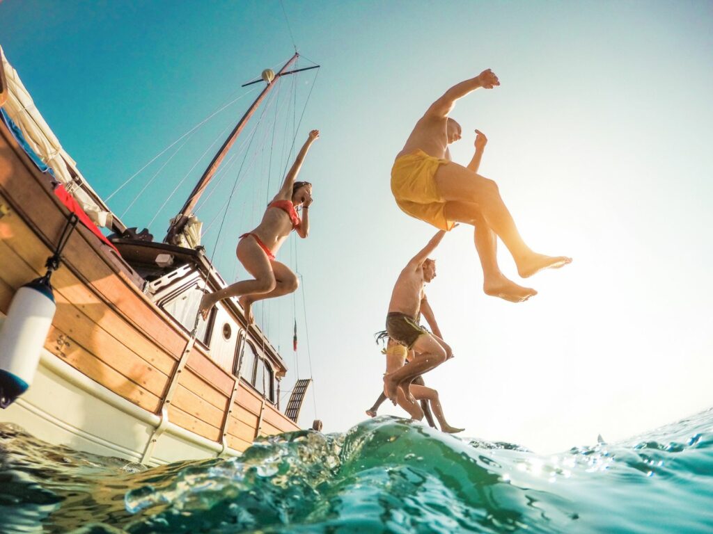 the best places to go with friends on holiday includes going a boat trip to ibiza