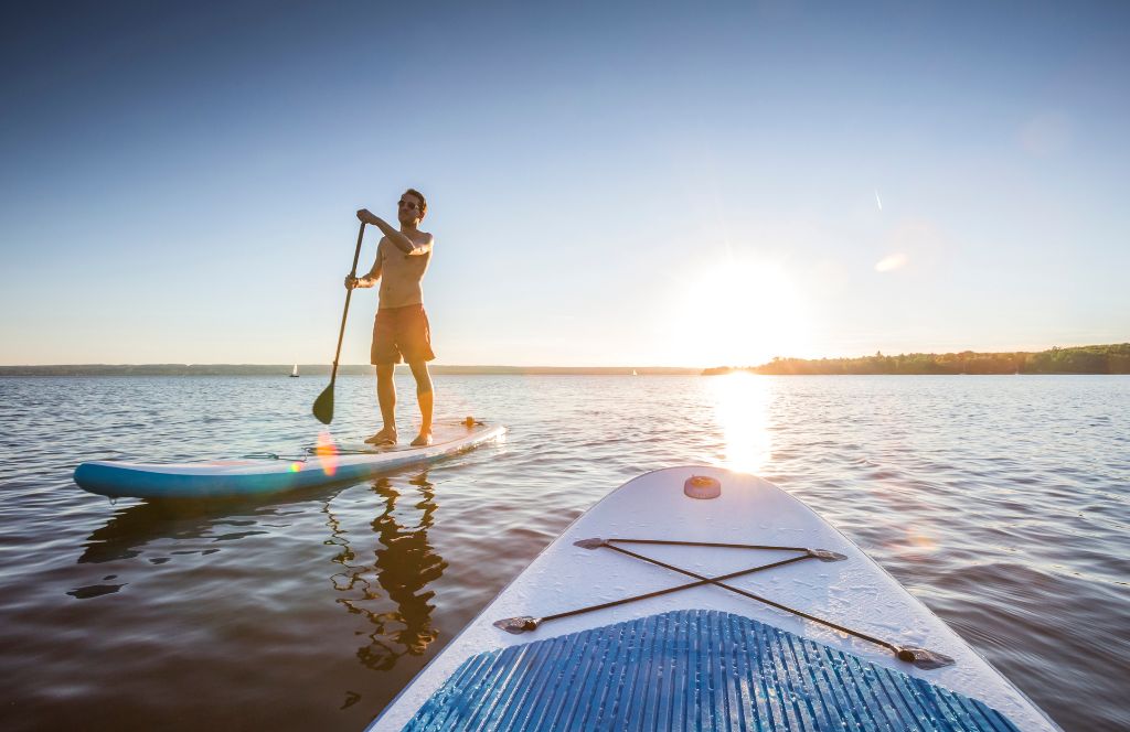 SUP paddle board on lake 