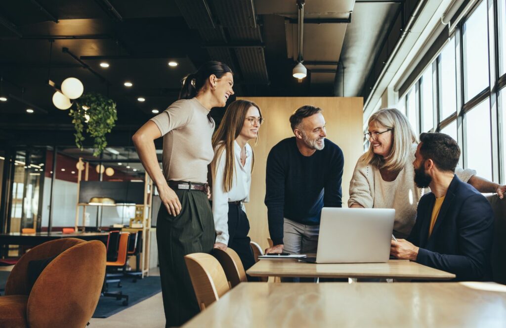 Colleagues laughing together at the office