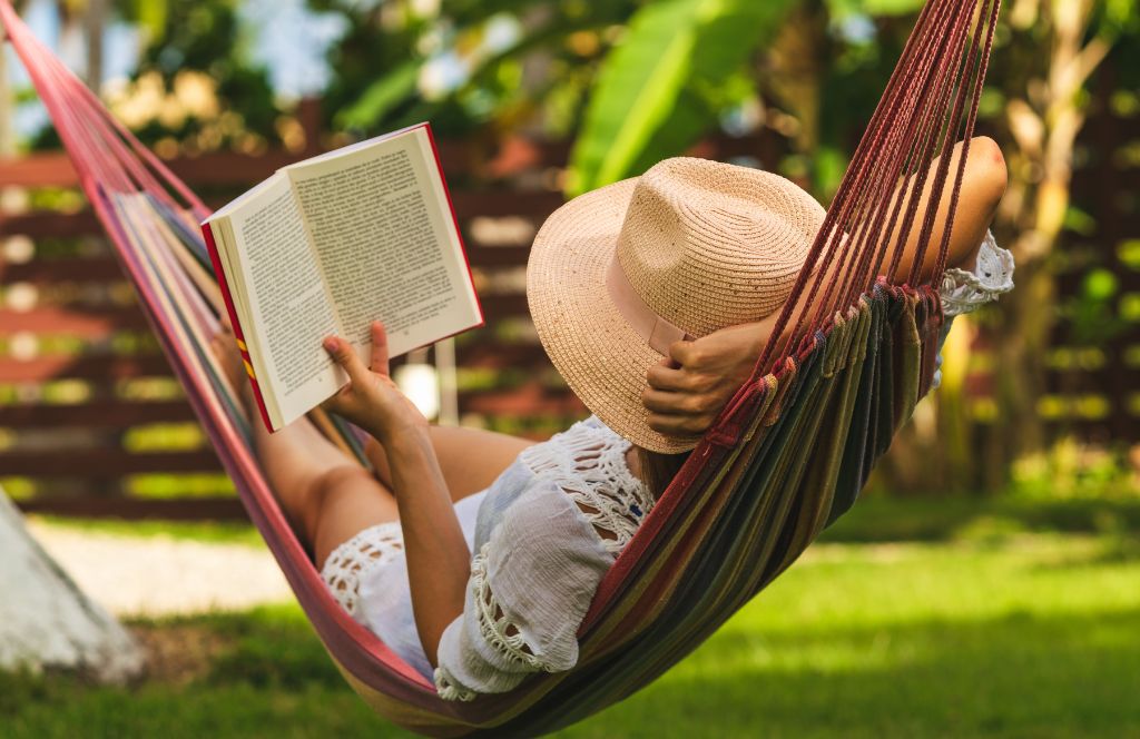 woman reading in summer hammock