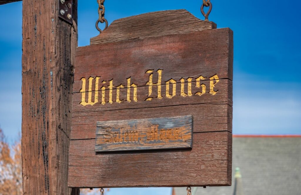 sign that says witch house in Salem, one of the most haunted places in the us