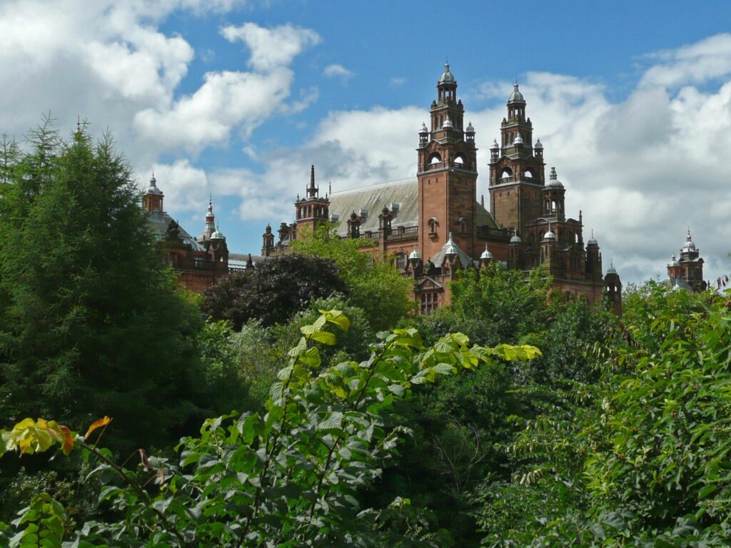 a view from kelvingrove park of kelvingrove art gallery and museum