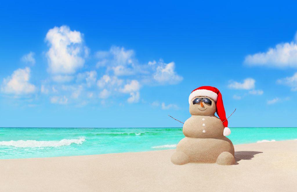 a snowman in the sand on a wintersun holiday
