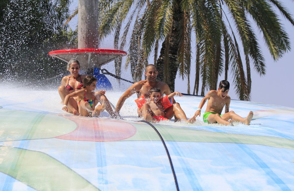 a family at a waterpark during their greece family vacations