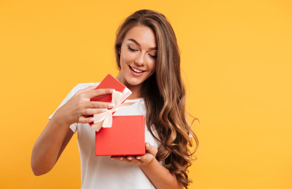a woman opens her luxury birthday present