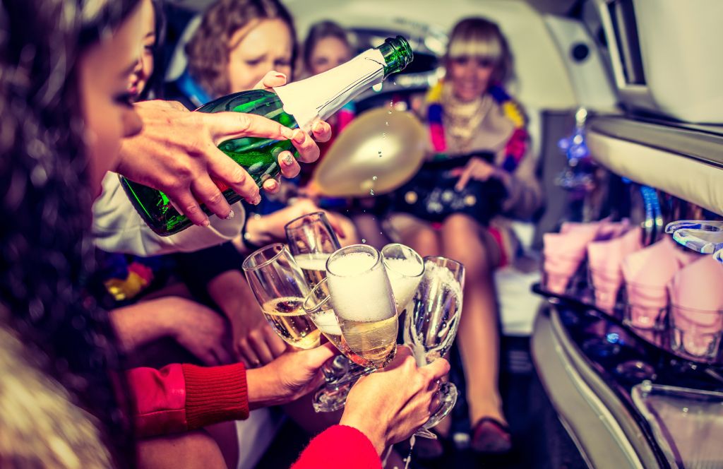 girls pour champagne during an international bachelorette party