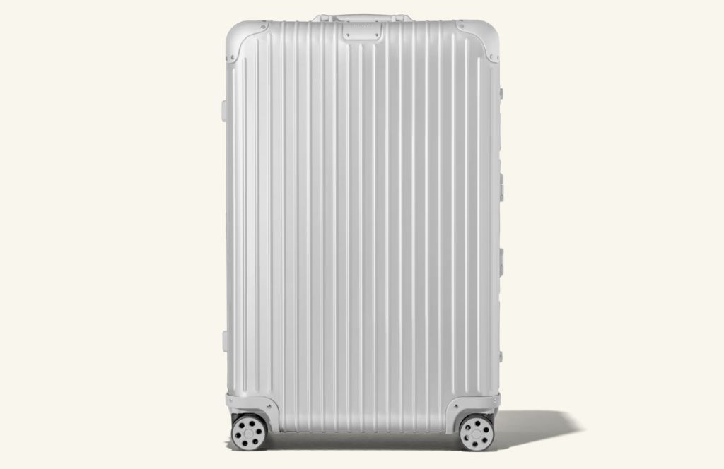 a white suitcase with wheels is the best luxury 60th birthday gift for men