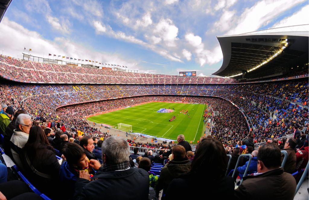 a large stadium filled with people thanks to gifting a season ticket as a 60th birthday present for men