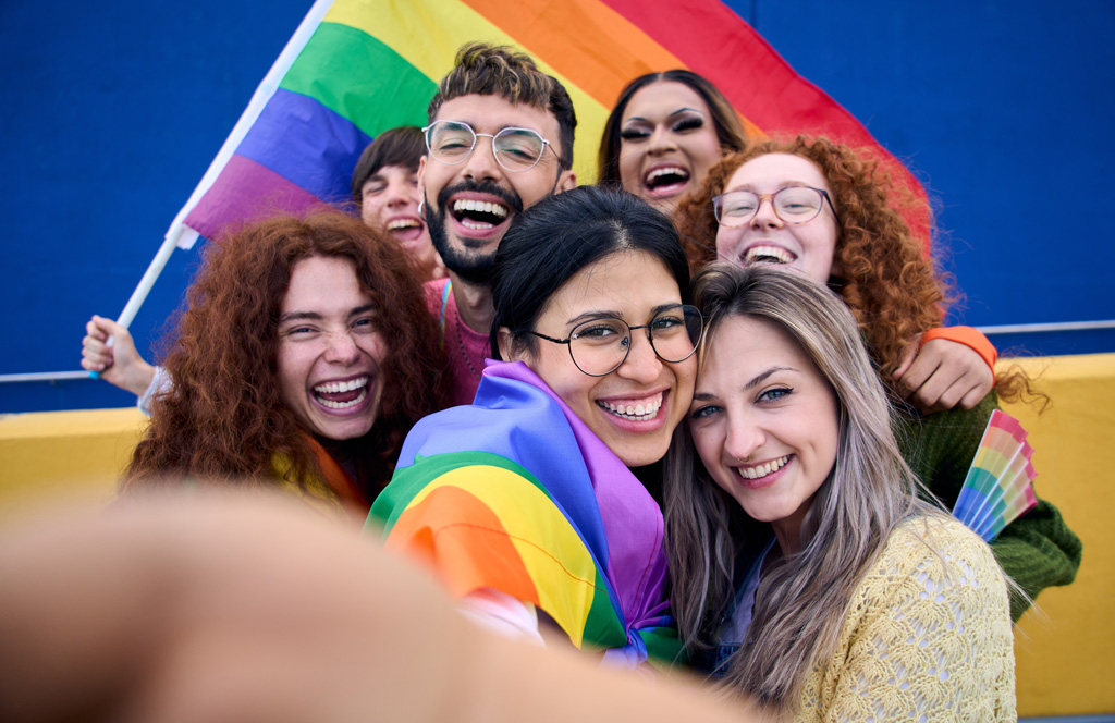 gay pride festivals 2024 group at flag