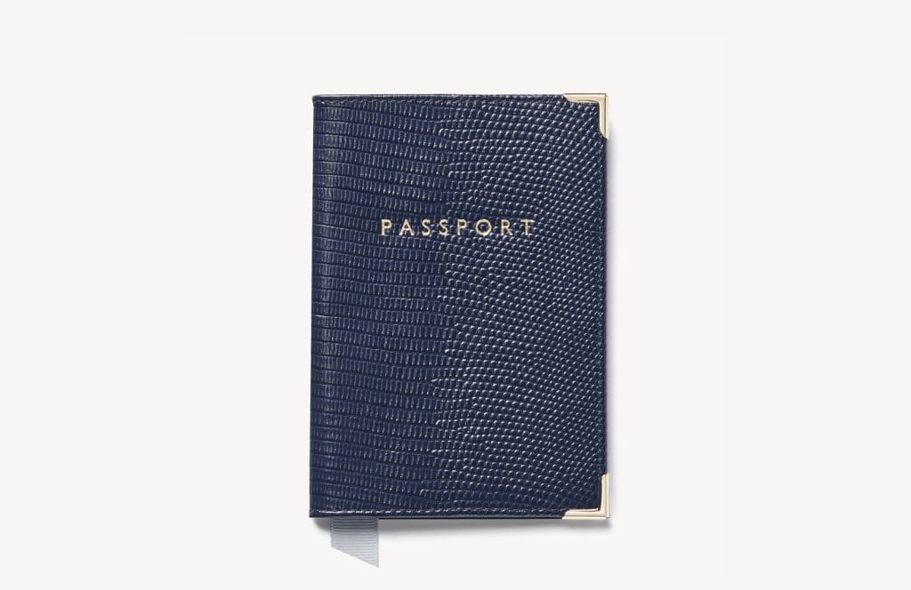 a passport cover is a great idea for a 70th birthday gift for a man or woman