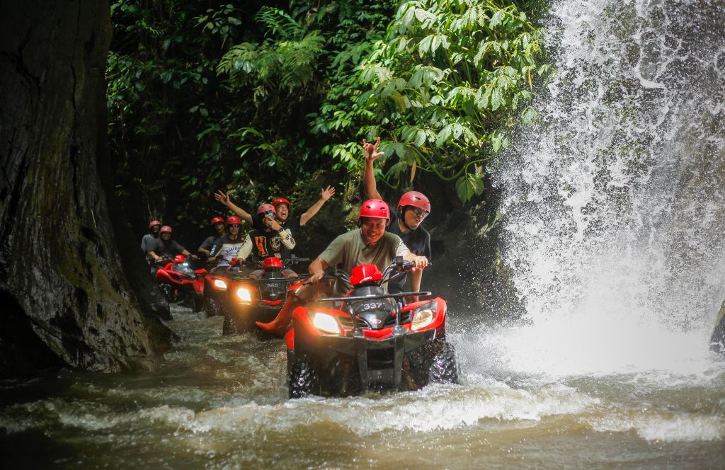 biking through waterfalls in bali in november