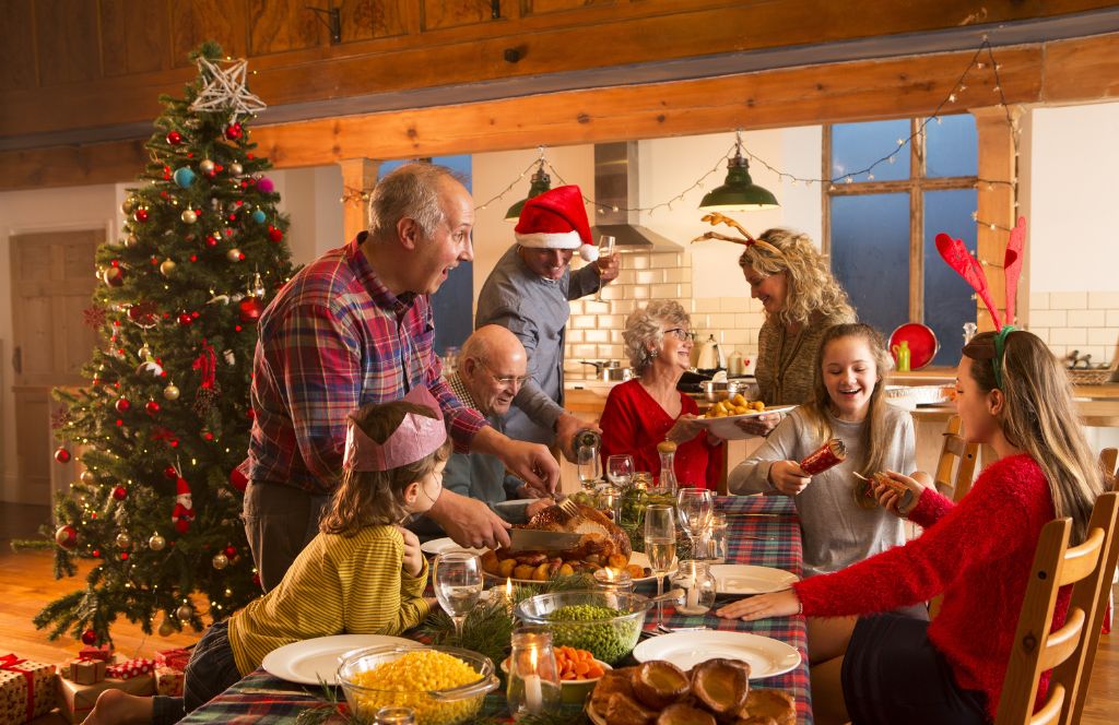 family on a christmas break in england pull crackers