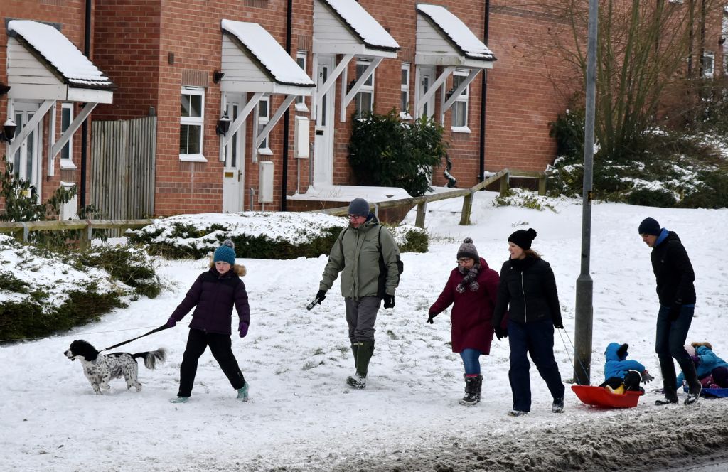 kids playing in the snow in the UK in england at christmas