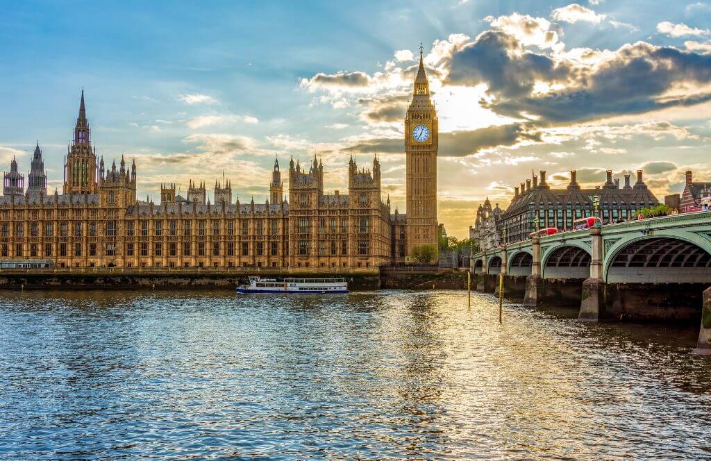 Houses of Parliament with Big Ben Tower and Westminster Bridge at sunset, London, UK