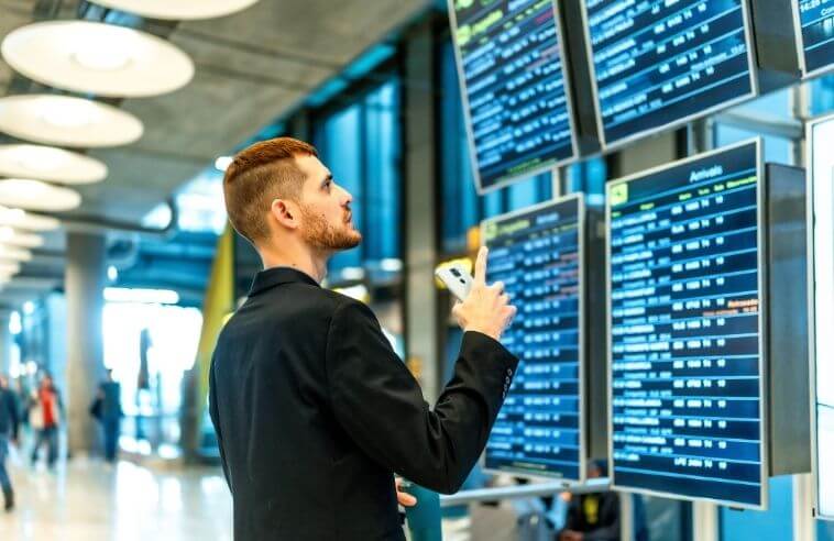 man checking flight status