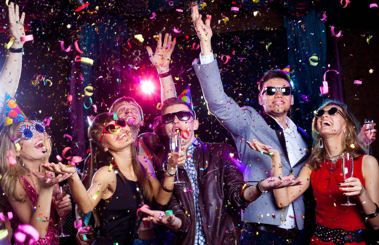 people partying on new years eve with glitter and sparkling lights